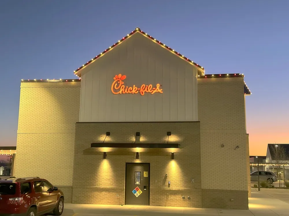 A restaurant roofline lit against a winter sunset in North Texas