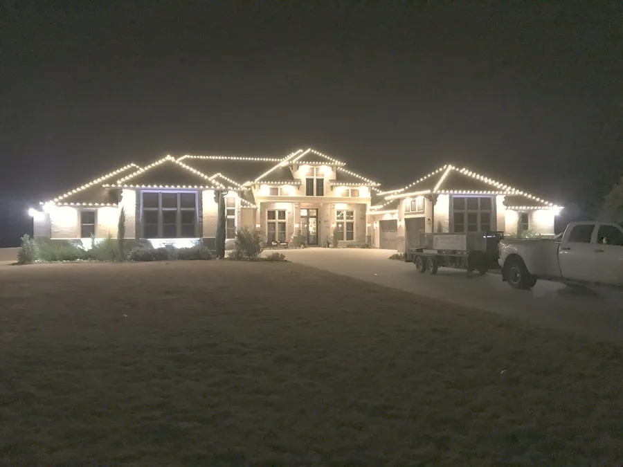 A long single-storey roofline held straight end to end, installed by South Custom Lighting in North Texas